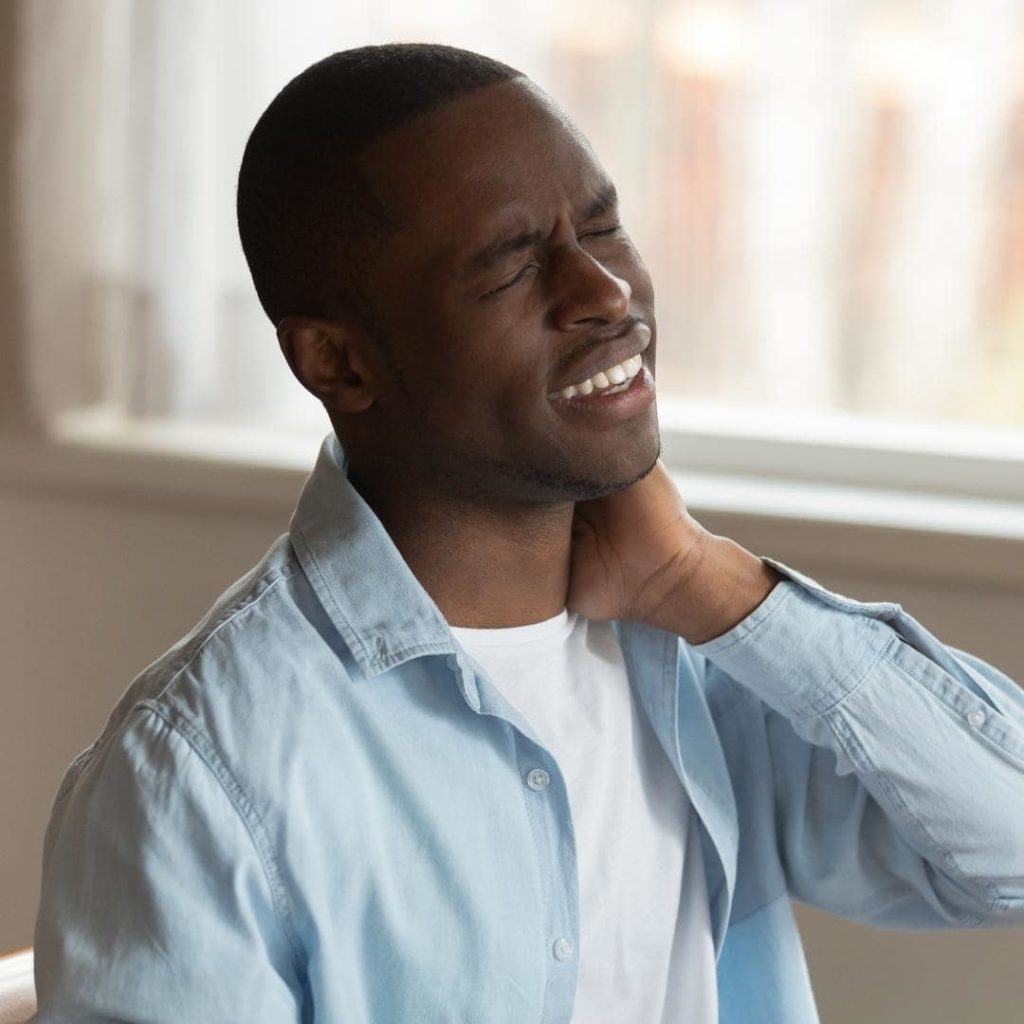 Image of man with pinched nerves and neck pain