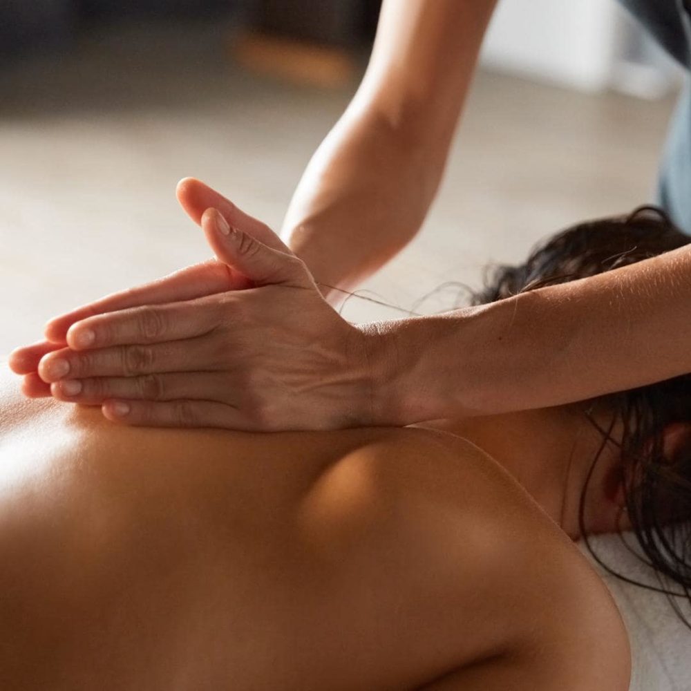 Photo of person getting an oncology massage by a massage therapist