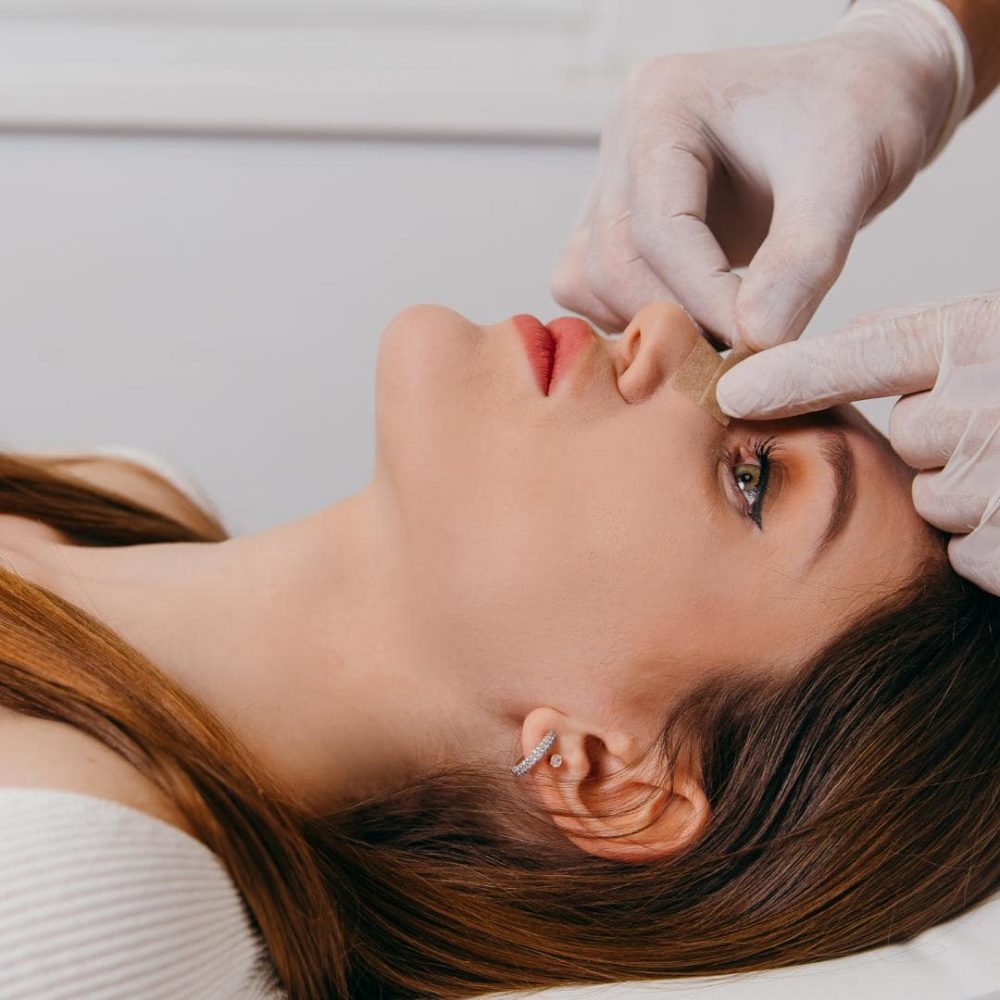 Photo of woman getting a manual lymphatic drainage after rhinoplasty consult